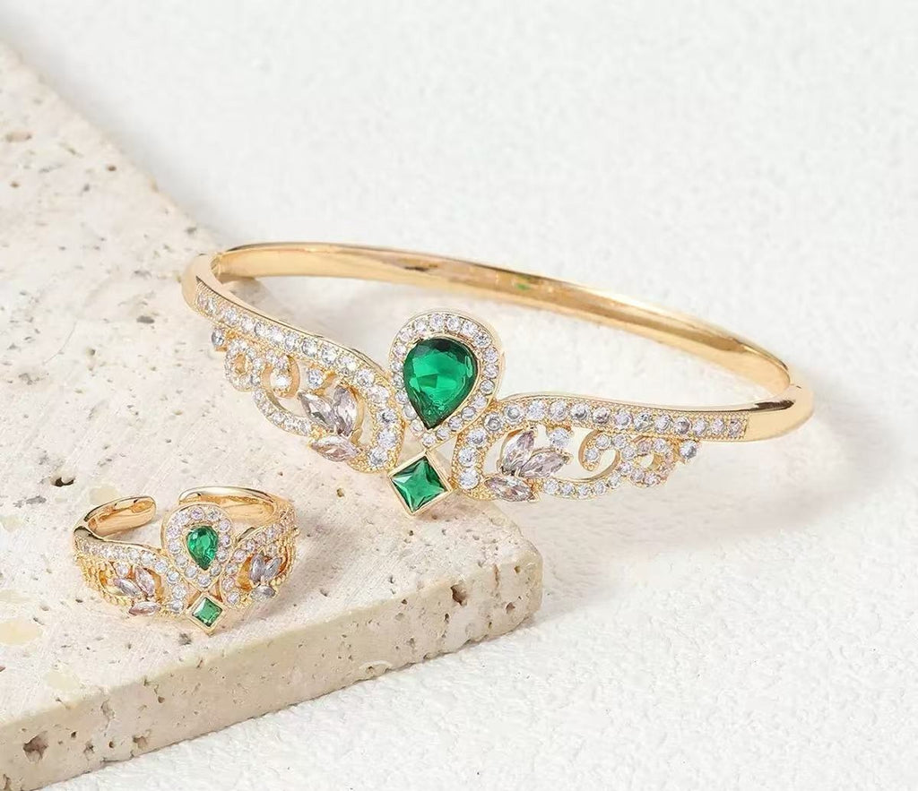 Emerald green CZ bracelet and matching ring with royal floral detailing