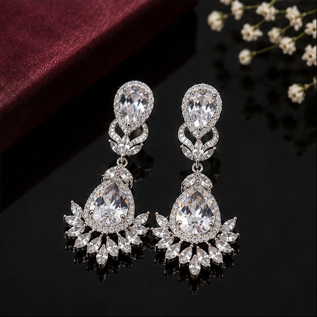 Elegant teardrop American diamond earrings with intricate floral detailing