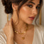 Golden double-layer necklace with textured snake chain, delicate link chain and polished ball pendant