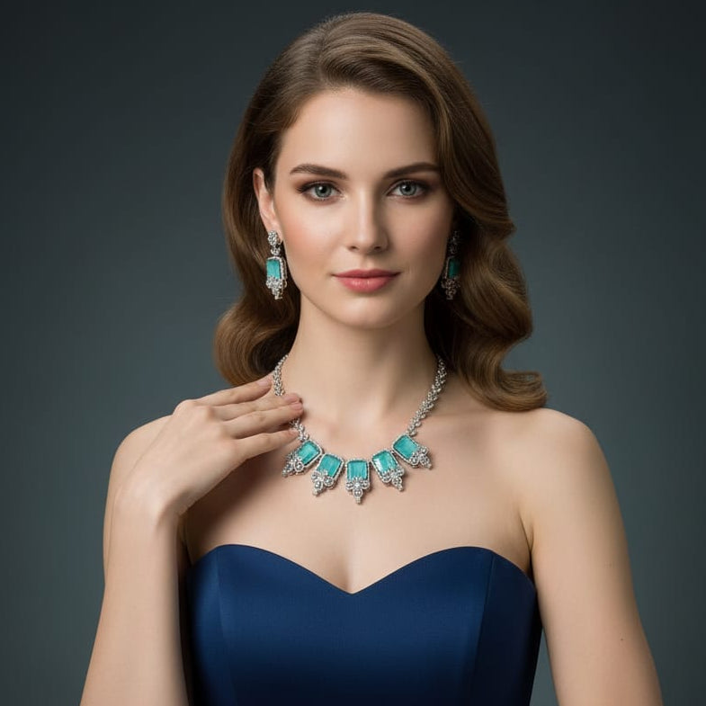 Woman wearing a turquoise necklace and earrings on a dark background