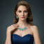 Woman wearing a turquoise necklace and earrings on a dark background