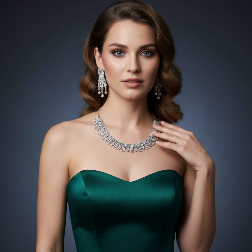 Woman wearing a green dress and sparkling jewelry against a dark background