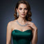 Woman wearing a green dress and sparkling jewelry against a dark background