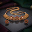 Antique Gold Ruby Kundan Lotus Filigree Choker Necklace Earrings Set on dark grey mirror surface with purple and green silk fabric backdrop showing wide bib choker with vertical filigree granulation spike panels and three open-petal lotus rose flowers with ruby red pear kundan CZ petals and polki white CZ centres alongside matching compact lotus flower stud earrings with ruby red pear kundan CZ petals and emerald green CZ centres with mirror reflections below