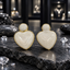 Cream Swirled Heart Earrings with Gold-Tone Borders