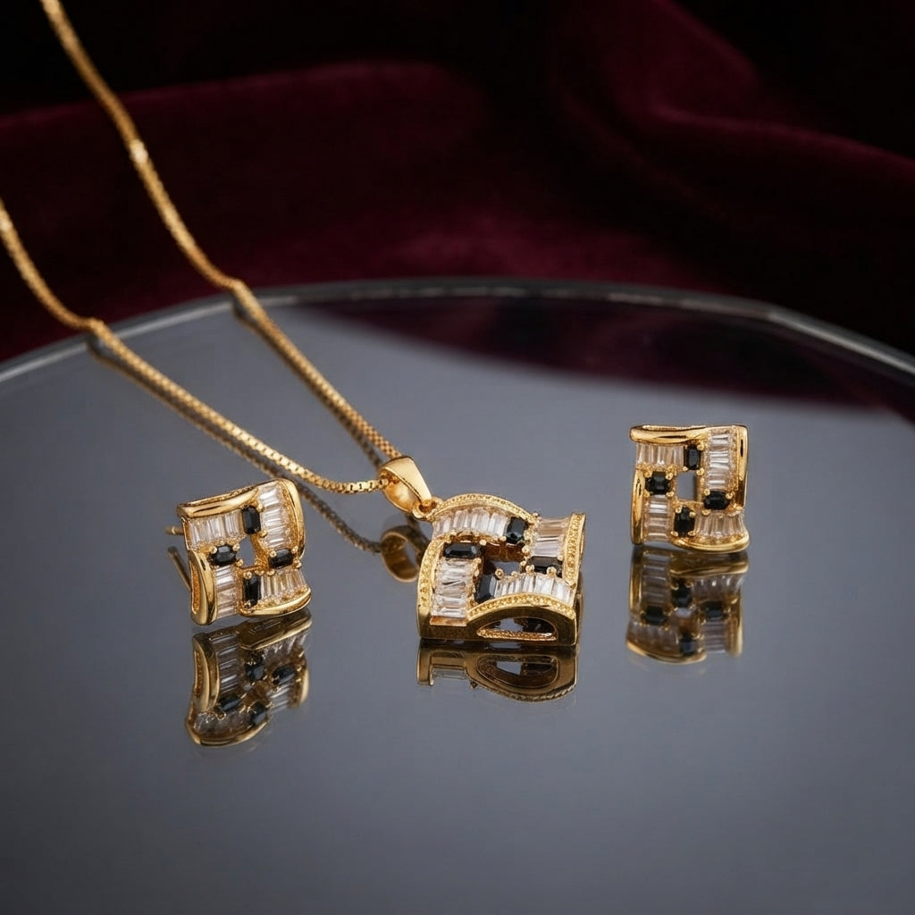 CZ Baguette Cross Concave Square Pendant Necklace and Earrings Set in Gold Emerald — 22K gold concave square pendant and stud earrings with deep vivid emerald green princess-cut CZ cross and white baguette CZ fill on burgundy velvet backdrop