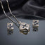 CZ Baguette Cross Concave Square Pendant Necklace and Earrings Set in Gold White — 22K gold concave square pendant and stud earrings with all-white channel-set baguette CZ fill on burgundy velvet backdrop