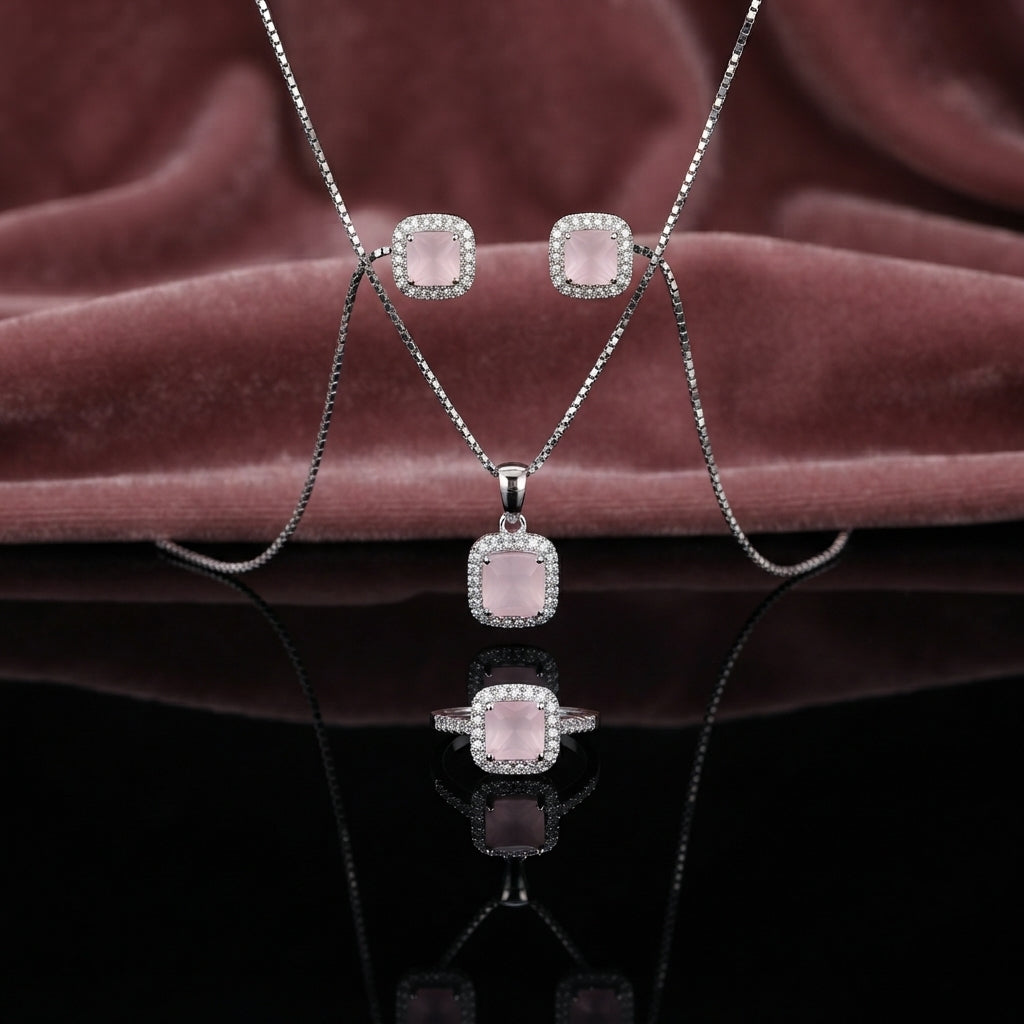 CZ Cushion Halo Pendant Necklace Stud Earrings and Ring Set in Teal Paraiba CZ silver-tone flat lay on dark teal velvet backdrop showing 3-piece set with teal cushion CZ center focal in white CZ micro-pavé rectangular halo pendant necklace matching stud earrings and cocktail ring with mirror reflection