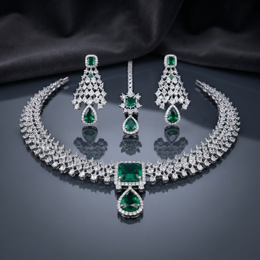 CZ Diamond Bridal Choker Necklace Earrings Maang Tikka Set in Royal Blue showing wide pave CZ tennis choker collar with large cushion and pear royal blue CZ centre pendant matching long chandelier earrings with geometric lattice panel and pear drop and maang tikka on dark mirror surface with charcoal satin backdrop