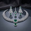 CZ Diamond Bridal Choker Necklace Earrings Maang Tikka Set in Royal Blue showing wide pave CZ tennis choker collar with large cushion and pear royal blue CZ centre pendant matching long chandelier earrings with geometric lattice panel and pear drop and maang tikka on dark mirror surface with charcoal satin backdrop