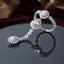 CZ Sunflower Cluster Hath Phool Hand Bracelet Ring Silver on dark mirror surface with burgundy velvet backdrop showing three sunflower cluster stations with round CZ centre micro-pave dome and marquise CZ petals linked by marquise CZ chain to matching finger ring cluster in rhodium silver-tone plating with mirror reflection below
