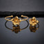 Gold 3D Five-Petal Ribbed Stripe Flower Open Cuff Bangle and Ring Matching Jewelry Set on dark grey glossy surface with charcoal stone backdrop showing 22K warm matte yellow gold-tone open cuff wire bangle lying flat with matching open adjustable ring standing beside it both featuring 3D five-petal rounded flowers with parallel horizontal ribbed stripe engraved petals and raised polished dome centres with sharp mirror reflections below