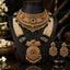 Gold Antique Emerald and Pearl Double Layer Grand Bridal Rani Haar Set displayed on neck stand in Mughal dark backdrop editorial with jasmine flowers showing 3-piece set with wide antique gold filigree choker and long multi-strand seed pearl and emerald bead rani haar with grand oval shield pendant and matching large oval chandelier earrings