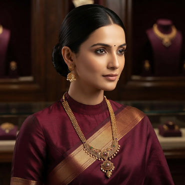 Gold Antique Multi-Color CZ and Pearl Filigree Jhumka Choker Necklace and Earrings Set flat lay on grey mirror surface with dark grey satin backdrop showing 2-piece set with dense filigree wire-work semi-circular choker band with ruby red and emerald green CZ accents and large jhumka dome pendant with pearl fringe drops and matching classic jhumka earrings with mirror reflection