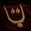 Gold Antique Ruby CZ Filigree Leaf Chain Necklace and Chandbali Earrings Set flat lay on grey mirror surface with dark grey satin backdrop showing 2-piece set with long graduated filigree leaf-link chain necklace with scattered ruby CZ accents and double-tiered Mughal pendant with pearl fringe drops and matching Chandbali earrings with mirror reflection
