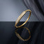Gold Ball Bead Band Pave CZ Bar Station Rigid Bangle on dark grey mirror surface with grey silk fabric backdrop showing 18K gold-tone rigid bangle with continuous round gold ball bead band and elongated rectangular micro-pave white CZ bar station with geometric gold end caps and hinge clasp with mirror reflection below