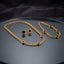 Gold Black Enamel Roman Disc Cuban Chain Necklace Bracelet Earrings Set — 3-piece matching set of heavy 22K gold-tone Cuban curb chain necklace with 5 black enamel Roman disc charms, matching bracelet with 4 disc charms, and round black enamel Roman disc stud earrings, luxury flat-lay on round mirror tray with dark charcoal silk backdrop