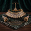 22K Gold-Tone Champagne Emerald-Cut CZ & Pear Polki Kundan Tiered Scalloped Bib Choker Necklace Gold Filigree Sphere Jhumka Earrings & Maang Tikka 3-Piece Bridal Set on green marble tray with dark green velvet drape backdrop