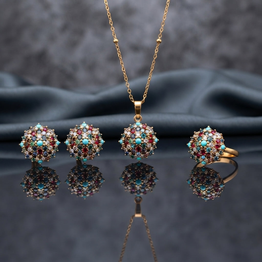 Gold CZ Cluster Dome 3-Piece Jewelry Set in Emerald Green showing pendant necklace on gold cable chain stud earrings and adjustable ring all with fully domed emerald green faceted CZ stone cluster in gold-tone prong setting on dark mirror surface with dark silk backdrop