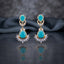 Gold CZ Double Teardrop Marquise Fan Chandelier Earrings in Turquoise pair on dark mirror surface with grey silk backdrop showing 18K gold-tone small turquoise pear CZ stud with white CZ pave halo infinity connector and large turquoise pear CZ drop with white CZ pave halo and marquise CZ fan crown with mirror reflection below