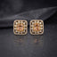 Gold CZ Open Filigree Rectangle Frame and Solitaire Stud Earrings in Mint Green worn by model with teal green outfit showing 22K gold-tone open rectangular filigree stud earring with mint green emerald-cut CZ centre on ear lifestyle shot