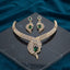 Gold CZ Peacock Feather Leaf Torque Necklace & Drop Earrings Set in Emerald Green CZ on dark grey marble with teal velvet backdrop