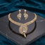 Gold CZ Peacock Feather Leaf Torque Necklace & Drop Earrings Set in White Crystal CZ on dark grey marble with teal velvet backdrop