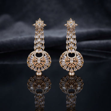 Gold CZ Star and Marquise Cascade Waterfall Sunburst Ball Globe Drop Earrings on dark mirror surface with navy charcoal satin backdrop showing 22K gold-tone pair with 8-pointed marquise white CZ star stud triple-strand marquise briolette CZ cascade waterfall stem and large open-work sunburst ball globe with baguette CZ bars champagne kite solitaires micro-pave rim and champagne CZ cabochon drop
