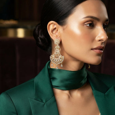 Gold CZ Sunburst Disc and Filigree Crescent Chand Bali Pear Drop Earrings on dark slate mirror surface with charcoal navy satin backdrop showing 22K gold-tone pair with micro-pave champagne CZ sunburst disc stud double open-loop scroll connector open crescent chand bali fan body with white CZ solitaire arch spike fringe border and 3 pear white CZ drops