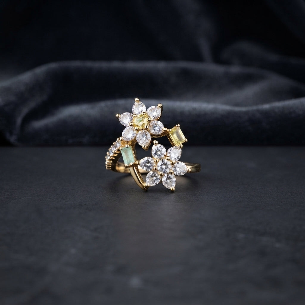 Gold Double Flower Cluster CZ Cocktail Ring in yellow citrine and mint green CZ accent variant — luxury flat-lay on stone surface with dark silk backdrop