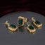Gold Emerald Rectangle CZ Double Halo Drop Earrings and Cocktail Ring close-up — showing large emerald green rectangle CZ in double white CZ pavé halo with small round emerald CZ top accent on 22K gold, luxury flat-lay on round mirror tray with burgundy velvet backdrop