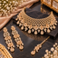 Champagne-tone floral choker necklace set with matching earrings and maang tikka.
