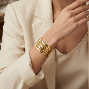 Gold-Tone Hammered Texture 5-Row Open Slot Cuff Wide Statement Bracelet worn on model wrist with cream blazer in editorial setting