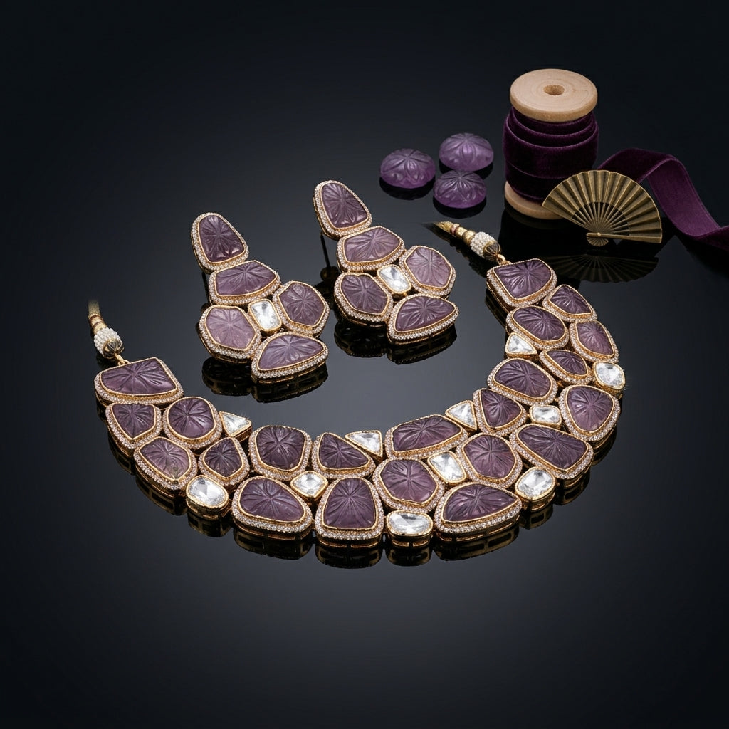 Gold-Tone Hand-Carved Amethyst Purple Polki & Rose-Cut CZ Kundan Wide Choker Necklace & Drop Earrings Bridal Set on black mirror surface with carved amethyst stones, gold fan and purple velvet ribbon backdrop