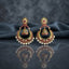 Gold Kundan Meenakari Chandbali Jhumka Earrings in ruby red and emerald green pair on dark mirror surface with grey silk backdrop showing 22K antique gold-tone oval floral Kundan stud with large crescent chandbali frame set with alternating ruby-red and emerald-green teardrop Kundan stones with domed Meenakari jhumka bell and full row of lustrous white pearl drops fringe with mirror reflection below