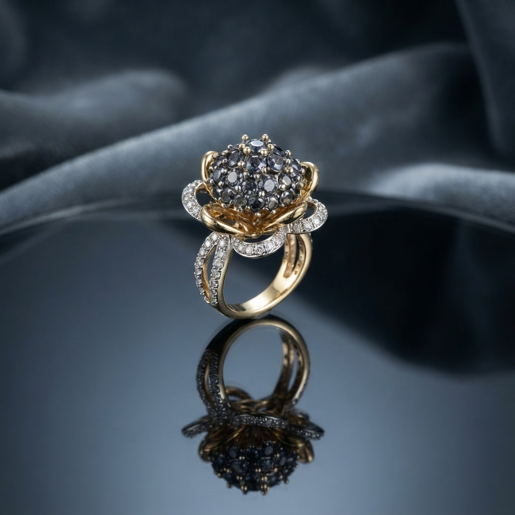 Gold Lotus Flower Cluster CZ Dome Cocktail Ring in Black — 22K gold-tone lotus flower basket ring with dense jet black CZ dome cluster crown, white CZ pavé petal halo, and split pavé shank, on dark mirror surface with charcoal silk backdrop