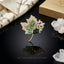 Gold-Tone Maple Leaf Pavé Emerald & Multicolor CZ Luxury Brooch on black reflective surface with white quartz crystal clusters and Premium Jewelry luxury brand box backdrop