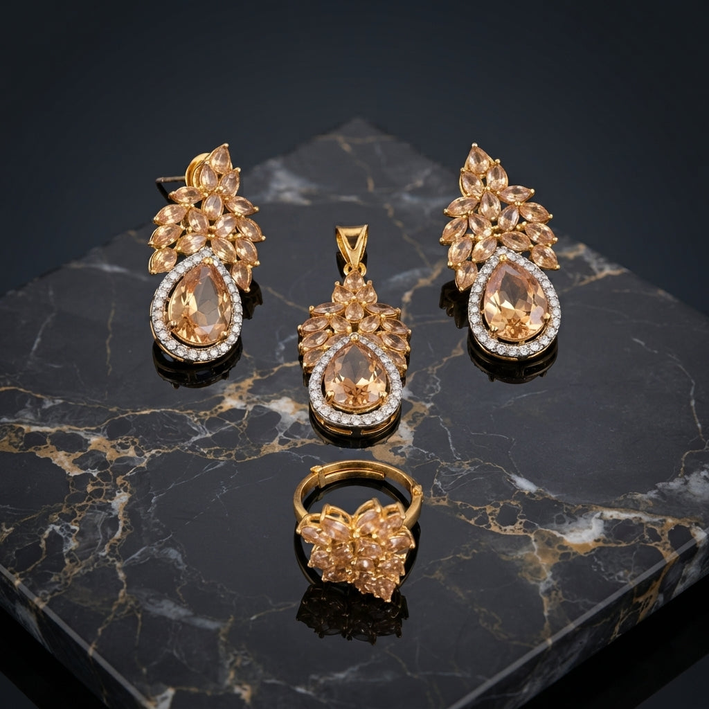Gold-Tone Marquise & Pear CZ Sunburst Floral Crown Pavé Halo Pendant Necklace Earrings & Ring Jewelry Set in Champagne Morganite on dark marble surface with warm gold geometric backdrop