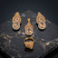 Gold-Tone Marquise & Pear CZ Sunburst Floral Crown Pavé Halo Pendant Necklace Earrings & Ring Jewelry Set in Champagne Morganite on dark marble surface with warm gold geometric backdrop