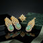 Gold-Tone Marquise & Pear CZ Sunburst Floral Crown Pavé Halo Pendant Necklace Earrings & Ring Jewelry Set in Mint Jade Green on black mirror surface with green marble and sage green silk fabric backdrop