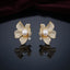 Gold-Tone Micro-Pavé CZ Orchid Flower Pearl Center Statement Stud Earrings on dark mirror surface with deep burgundy velvet backdrop