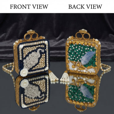 Gold Mughal Minaudère Rectangular Navy Peacock CZ Pearl Emerald Leaf Clutch Bag — front: navy blue crystal border, ivory kundan field, white CZ peacock motif, carved MOP flower; back: emerald green leaf petal field, blue agate oval, gold zardozi vine, pearl tassel; dark silk backdrop with mirror reflection