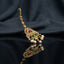 Gold Multi-Color CZ Mughal Peacock Maang Tikka with Pearl Drops — antique 22K gold-tone traditional South Asian bridal maang tikka with elaborate Mughal peacock pendant featuring ruby CZ center focal emerald green CZ peacock wing fill white CZ micro-pavé scrollwork body marquise CZ leaf crown and 3 cream pearl drops on long marquise CZ tikka chain displayed on dark charcoal satin backdrop with mirror surface reflection