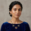 Gold-Tone Multicolour Gemstone & Seed Pearl Fringe Station Chain Necklace & Stud Earrings Set worn on model in blue velvet top with neutral studio backdrop