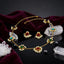 Gold-Tone Multicolour Gemstone & Seed Pearl Fringe Station Chain Necklace & Stud Earrings Set flat lay on dark mirror surface with white crystal quartz clusters, black faceted beads and deep burgundy velvet backdrop