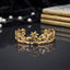 Gold Ocean Marine Life Open Cuff Bangle in 18K antique gold-tone PVD stainless steel on dark grey mirror surface with black silk backdrop and pearl string showing wide open cuff with fully sculpted 3D marine motifs including sea turtle scallop shell palm tree starfish seahorse dolphin coral and wave scrolls with mirror reflection below