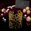 Gold-Tone Openwork Wild Clover Flower & Heart Vine Wide Open Cuff Statement Bracelet on black mirror surface with scattered pearls, pink roses and burgundy velvet backdrop
