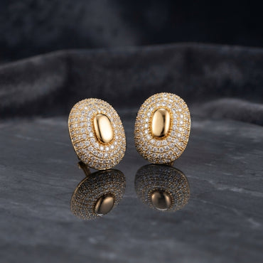 Silver-tone oval pavé stud earrings with smooth oval centers.