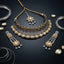 22K Gold & Oxidized Silver Dual-Tone Large Oval Polki Kundan Diamond-Cut Mesh Wide Bib Choker Necklace Drop Earrings & Maang Tikka 3-Piece Bridal Set on black mirror surface with silver wire coils and gold polki pear stone props backdrop