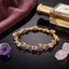 Silver-Tone White CZ Oval & Marquise Vine Wave Tennis Bracelet on dark reflective surface with grey silk scarf and crystal perfume bottle backdrop